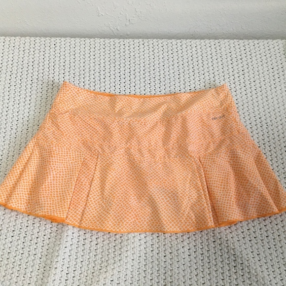 NIKE Pants - NIKE DRYFIT TENNIS SKORT, WOMAN SIZE MEDIUM ORANGE AND WHITE